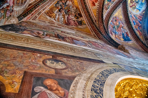 Orvieto, Italy - July 3, 2021: Interior view of city Cathedral with frescoes and paintings.