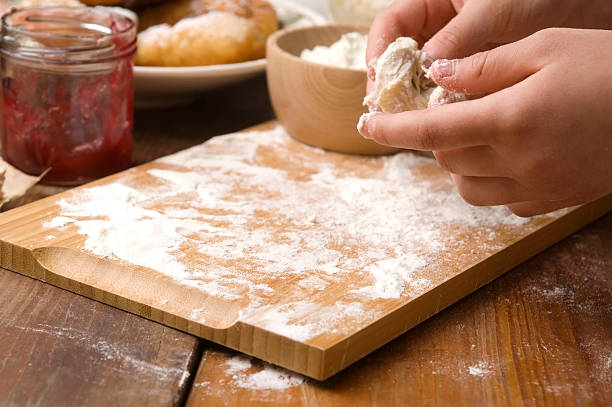 istock Detail of hands kneading dough 148488228