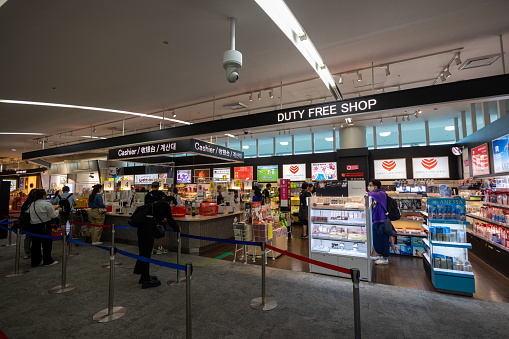 Fukuoka, Japan - April 22, 2023 : Customers shop at the Duty Free Shop at Fukuoka Airport in Kyushu, Japan.