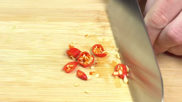 Knife Cut Chili Pepper on Wooden Cutting Board. Hot Spicy Food concept