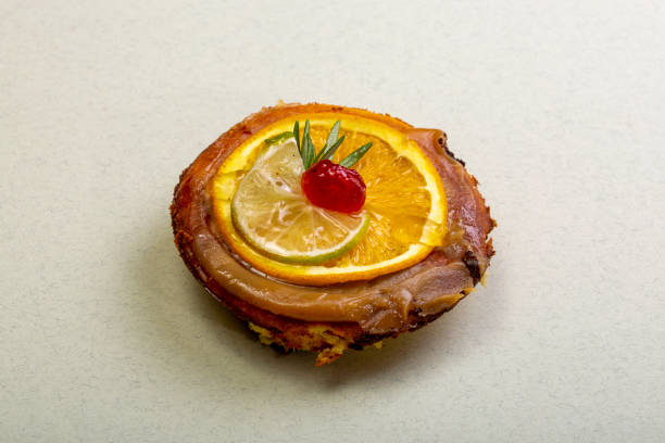 istock Cheese cake with marmalade and lime and orange slices 1484887021