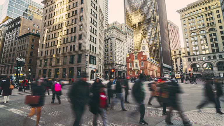 Time lapse of Crowd pedestrian and business tourist walking and crossing street intersections at Boston Old State House in Massachusetts, Boston, United States