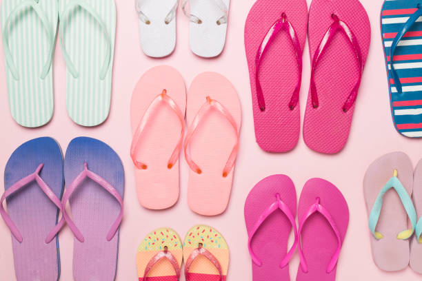 istock Many bright flip flops on color background, top view 1484892162