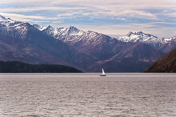 Sailboat on a mountain lake stock photo