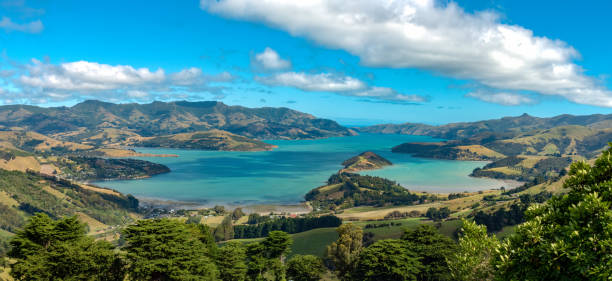 Akaroa on Banks Peninsula in the Canterbury Region of the South Island of New Zealand. The area was also named Port Louis-Philippe by French settlers after the reigning French king Louis Philippe I stock photo