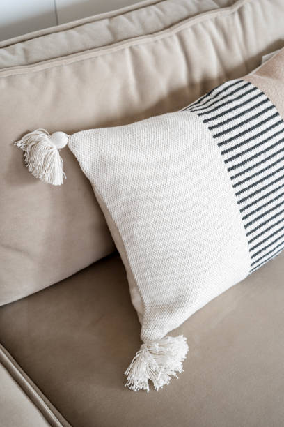 istock Close up view of soft cushion on comfortable sofa in room 1484896753