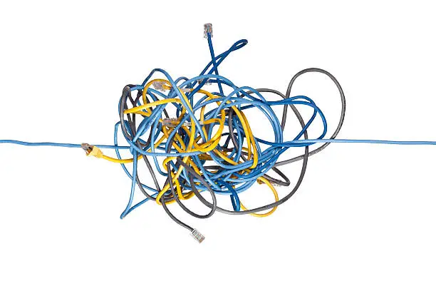 Photo of Tangled network cables on white background