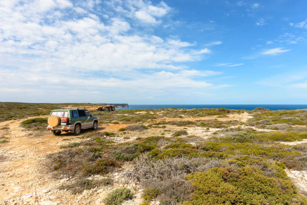 All wheel drive car stands on the cliffs. Nullarbor Plan, Great Australian bay, Southwest coast, Western Australia stock photo