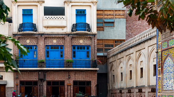 the facade of a building in a street in Lahore, Pakistan.