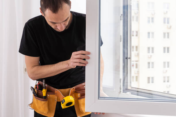 istock Handsome young man installing bay window in a new house construction site 1484900383