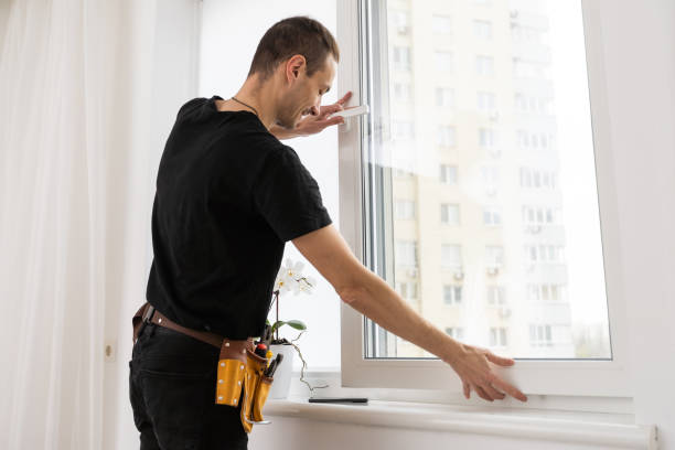 istock Master in gloves adjusting pvc windows with screwdriver closeup. Installation of plastic windows repair and maintenance concept 1484900438