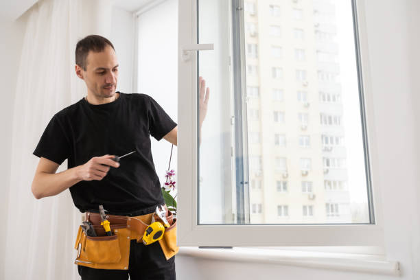 istock Handyman using a cordless screwdriver to install a window handle. Qualified worker services, home repair and renovation. 1484900473