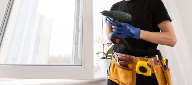 istock Young repairman fixing window frame in room at daytime 1484900741