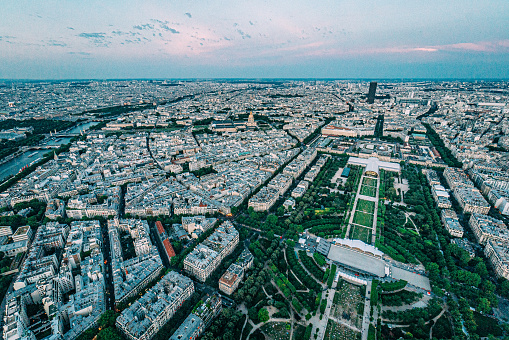 High Angle View from Eiffel Tower of Champ de Mars Park at Sunset on a Summer Evening. Grand Palais Éphémère is centered at the southeast end of the park.