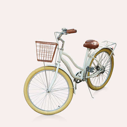 white frame bike , brown front basket, brown handlebar and seat, yellow bicycle tire, on isolated background, object, transpotation, decor, fashion, copy space