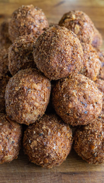 istock Scotch eggs on a wooden chopping board display regimentally. 1484904082