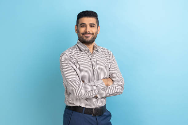 istock Successful businessman posing with happy confident expression looking at camera, keeping arms folded 1484904693