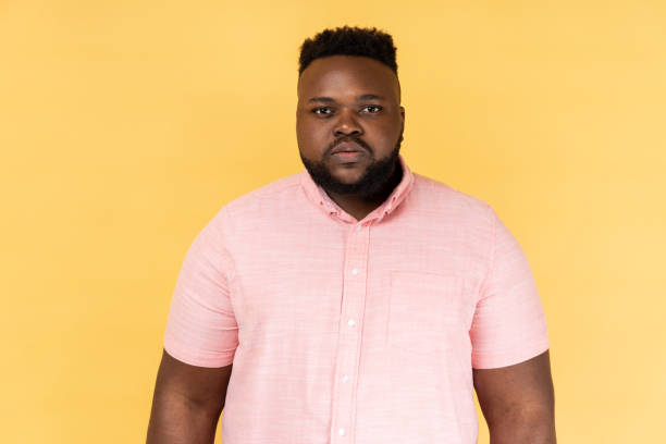istock Man standing and looking at camera with bossy facial expression, being in bad mood. 1484905748