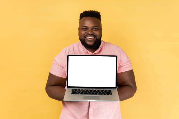 istock Man showing laptop with blank display for advertisement, having satisfied expression. 1484905751