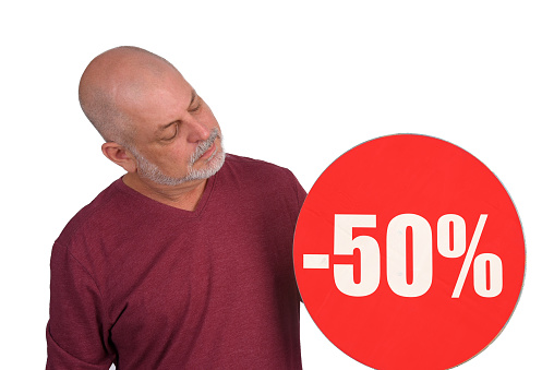 bald adult man holding 50% discount sign, store promotion