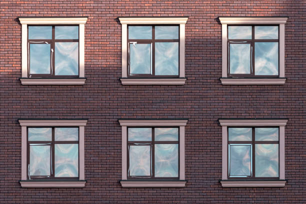 istock The facade of a brick house with identical square windows 1484906659