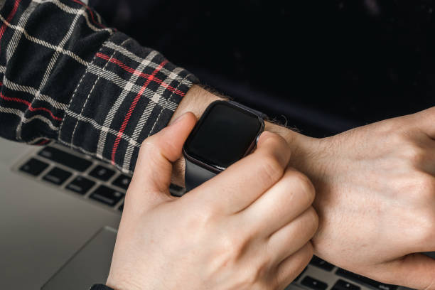 istock A man uses a smart watch, close-up technology. 1484906710