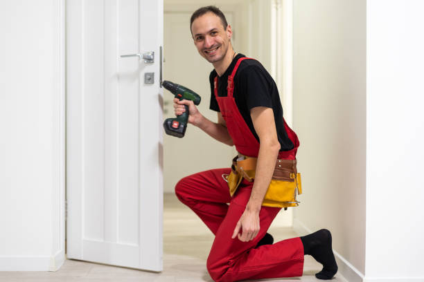 istock Young repairman checking new door lock 1484907342