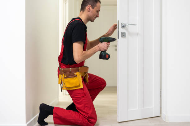 istock Young repairman checking new door lock 1484907551