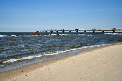 Concrete pier on a sandy beach by the Baltic Sea in Miedzyzdroje, Poland