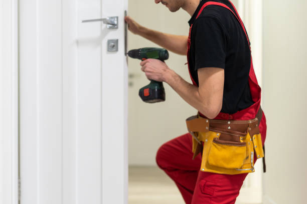 istock The master adjusts the fittings in the doors. The plastic door jammed does not work. The plastic door does not open 1484907868