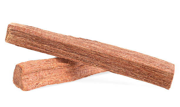 istock Chandan - two sandalwood sticks isolated on a white background, front view. 1484910907