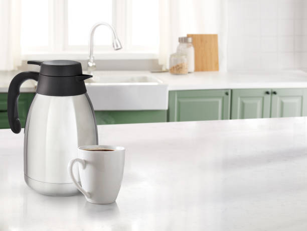 istock Coffee mug in a kitchen with a marble counter top and sink in the background 1484914401
