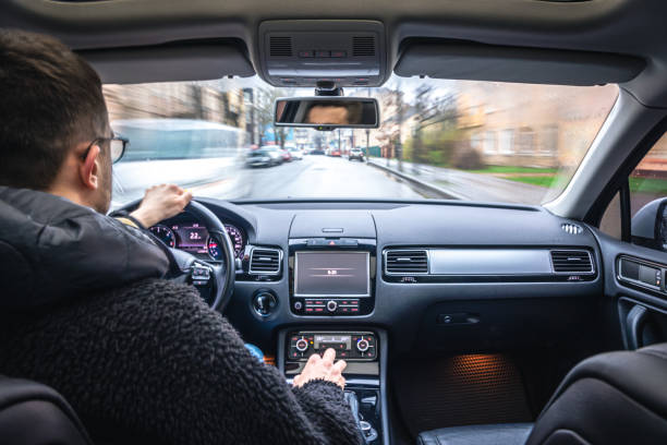 istock Hands on the wheel when driving at high speed from inside the car. 1484920841