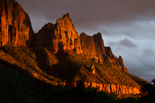 A view of a mountain range at sunset in Zion National Park in Utah, USA.