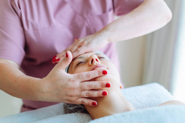 istock Cosmetologist making face massage at beauty salon 1484926219