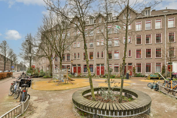 a courtyard with a fountain in front of a building