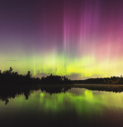 A beautiful display of Northern Lights above a still lake in Nova Scotia.