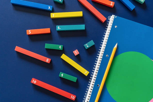 Math fractions on blue background. Interesting math for kids. Education, back to school concept. Geometry and mathematics materials. Close up
