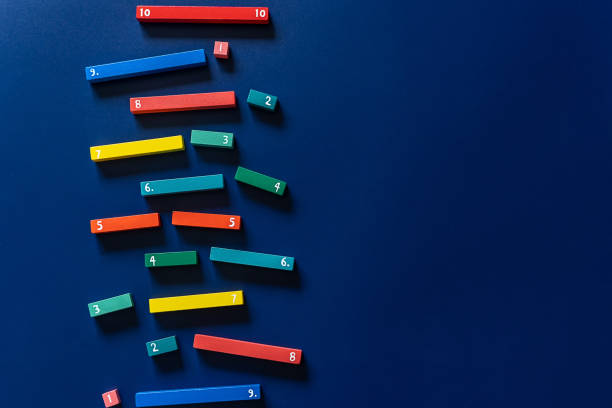 Math fractions on blue background. Interesting math for kids. Education, back to school concept. Geometry and mathematics materials. Close up