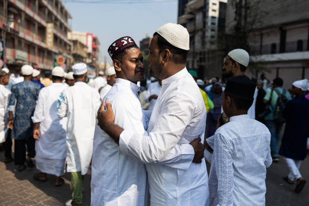 Eid Ul Fitar Greeting Kolkata, West Bengal, India 04/22/2023: 
In this picture people are greeting each other at Eidgah, the holli place during Eid ul Fitar. 
Eid al-Fitr is celebrated by Muslims worldwide because it marks the end of the month-long dawn-to-sunset fasting of Ramadan.[6] Some Muslims, however, do not view it as a sacred holiday.[7] Eid al-Fitr falls on the first day of Shawwal in the Islamic calendar; this does not always fall on the same Gregorian day, as the start of any lunar Hijri month varies based on when the new moon is sighted by local religious authorities. The holiday is known under various other names in different languages and countries around the world. The day is also called Lesser Eid, or simply Eid.[8] muslim photographer stock pictures, royalty-free photos & images