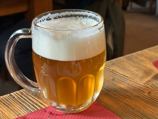 istock Mug of Beer on wooden table 1484934942