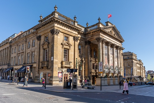 Newcastle upon Tyne, United Kingdom – April 19, 2023: The Theatre Royal, an iconic Neoclassical building on Grey Street in the city centre of Newcastle upon Tyne, UK.