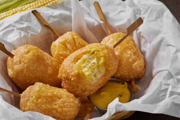 Beer Battered Corn on the Corn Beer Battered Corn on the Corn with Spicy Mustard Dip corn cob eaten stock pictures, royalty-free photos & images