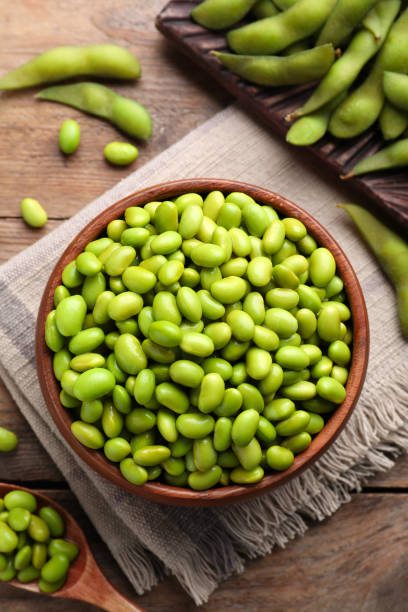 istock Delicious edamame beans on wooden table, flat lay 1484939786