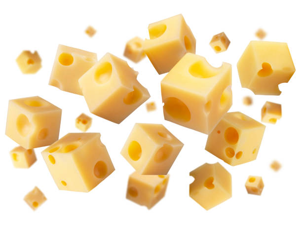 istock Superbly retouched cheese cubes fly and levitate in space. Isolated not white 1484944096