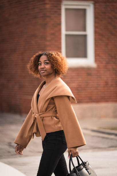 istock Young Black woman walks to office for work 1484944416