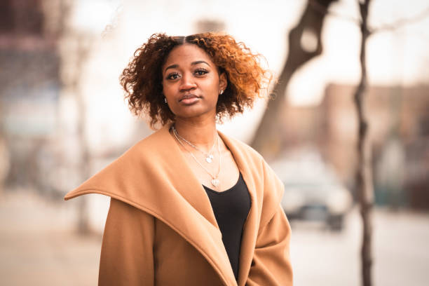 istock Young Black woman walks to office for work 1484944417