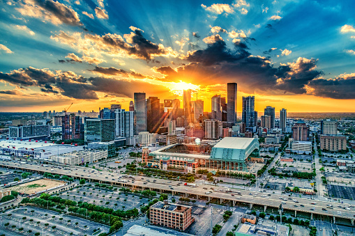 A beautiful brilliant sunset over the downtown skyline of Houston, Texas on an early spring evening shot from an altitude of about 600 feet during a helicopter photo flight.