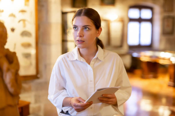 istock Woman visiting sculpture hall in historical museum 1484945699