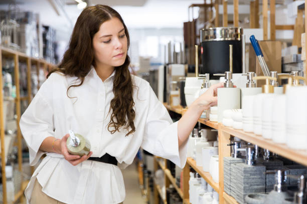 istock Female shopper choosing bath deodorant at hardware store 1484945721
